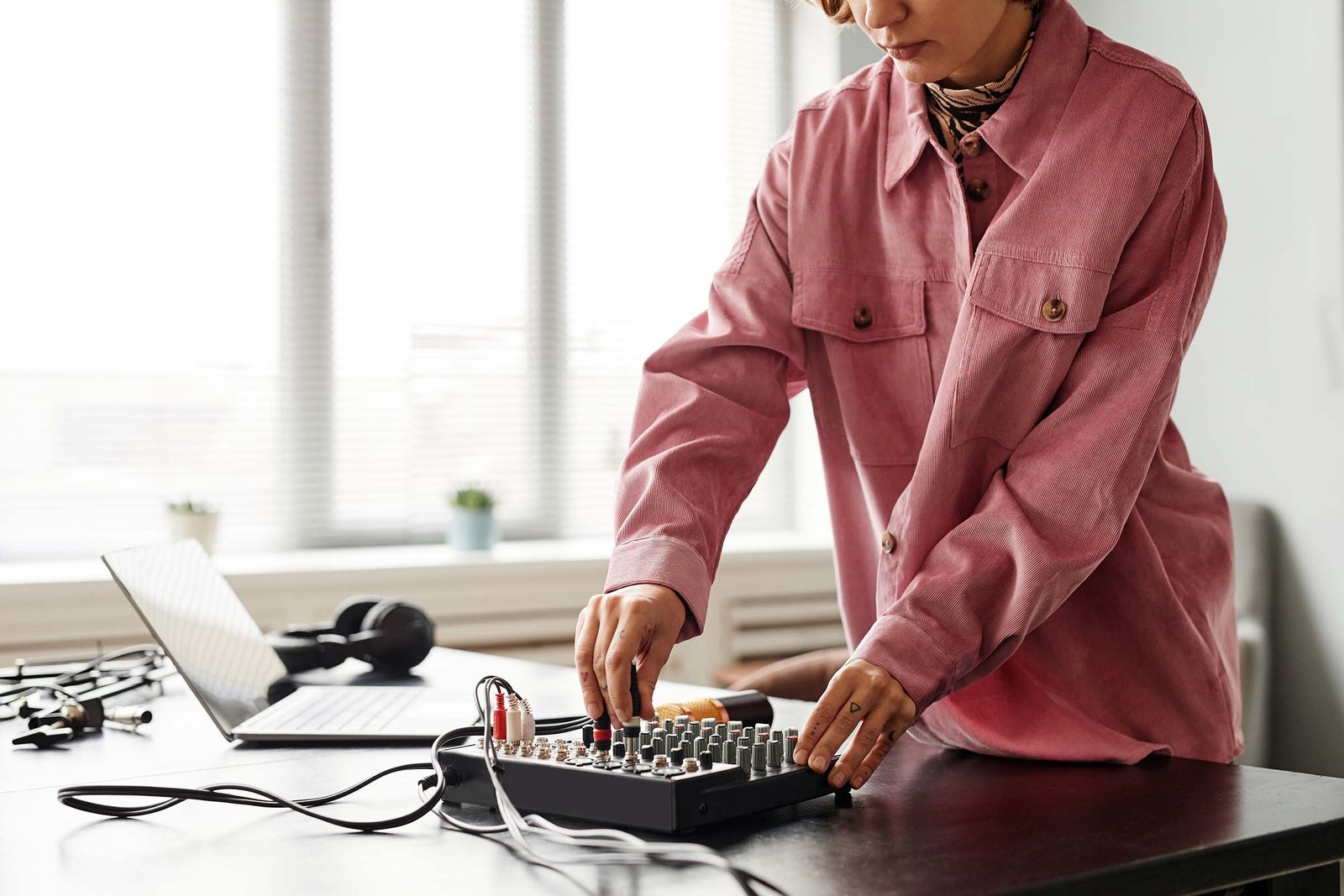 young-woman-setting-up-audio-equipment-UCEFGBD.jpg